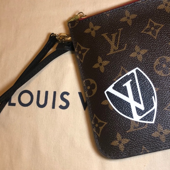 LV wristlet from World Tour collection. Authentic